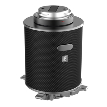A black, cylindrical throwing hook device with a visible control button, designed for aerial delivery technology.